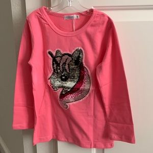 Pink long sleeve shirt with a sequin unicorn pattern